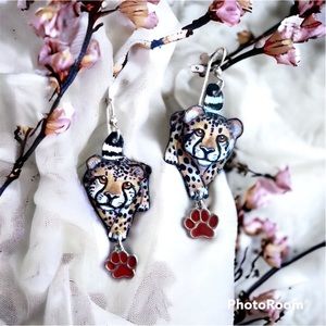 Hand painted cute little cheetah earrings the wires are sterling silver.